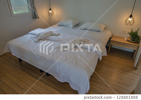 Modern minimalist bedroom with geometric pendant lights Modern minimalist bedroom with geometric pendant lights 128801808