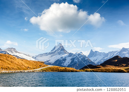 Sunny Bachalpsee lake in Switzerland reflects alpine beauty Sunny Bachalpsee lake in Switzerland reflects alpine beauty 128802051