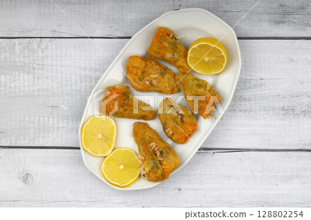 Pumpkin or Zucchini Flowers Dolma Stuffed with Rice Pilaf . Turkish Food in Plate. Traditional Organic Food. 128802254