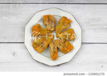 Pumpkin or Zucchini Flowers Dolma Stuffed with Rice Pilaf . Turkish Food in Plate. Traditional Organic Food. 128802270