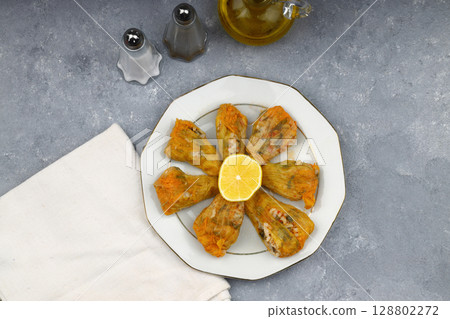 Pumpkin or Zucchini Flowers Dolma Stuffed with Rice Pilaf . Turkish Food in Plate. Traditional Organic Food. 128802272