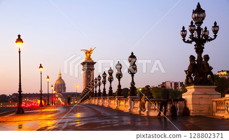 Hotel of Invalides from bridge of Alexandre III in early morning 128802371