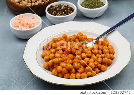 Chickpeas or Nohut, a traditional Turkish dish, ready to be eaten on the table. Chickpeas or Nohut, a traditional Turkish dish, ready to be eaten on the table. 128802742