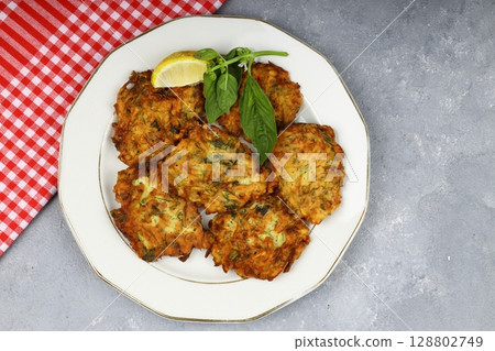 Mucver, Turkish traditional food. (Turkish cuisine) Homemade Food with Zucchini. 128802749