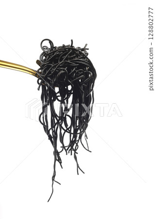 Spaghetti pasta with black ink squid in ladle on isolated white background. 128802777