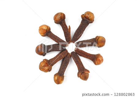 Dry cloves isolated on white background. Top view. Flat lay 128802863