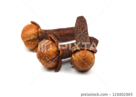 Dry cloves isolated on white background. Top view. Flat lay Dry cloves isolated on white background. Top view. Flat lay 128802865