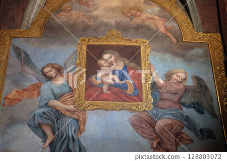 Virgin Mary with baby Jesus, fresco in the Franciscan Church of the Annunciation in Ljubljana, Slovenia 128803072