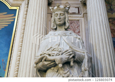 Statue of the saint on the altar of Saint Francis of Assisi in the Franciscan Church of the Annunciation in Ljubljana, Slovenia 128803074