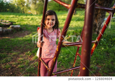 Playing joyfully in a sunny park on a warm spring afternoon 128804604