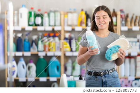 Woman chooses gel and washcloth Woman chooses gel and washcloth 128805778
