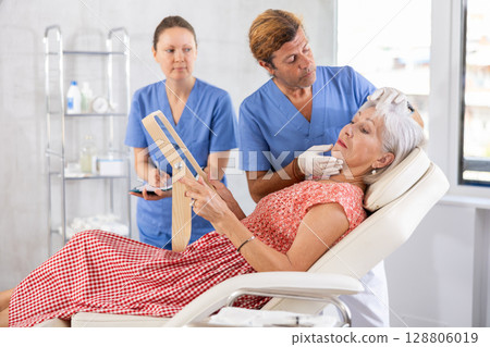 Attending medical consultation. Attending medical consultation. 128806019