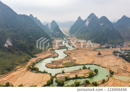 Cao Bang river winding through rice paddies in Vietnam Cao Bang river winding through rice paddies in Vietnam 128806886