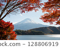 Mount Fuji rising over lake and colorful autumn foliage in Japan 128806919