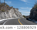Winding mountain road passing through rocky cliffs in Sonora, Mexico 128806929
