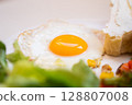 Tasty and healthy breakfast on a plate, scrambled eggs with vegetables, salad and toast, healthy eating and weight loss, weight gain, dietitian nutritionist, Close-up 128807008