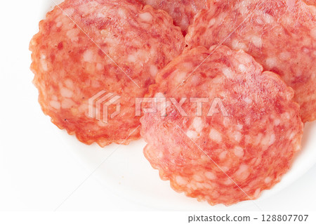 Close-up of sliced salami on a plate Close-up of sliced salami on a plate 128807707