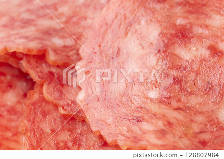 Sliced salami close-up 128807984