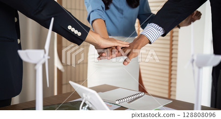 Sustainability Collaboration. Business team celebrating success in renewable energy project. Sustainability Collaboration. Business team celebrating success in renewable energy project. 128808096