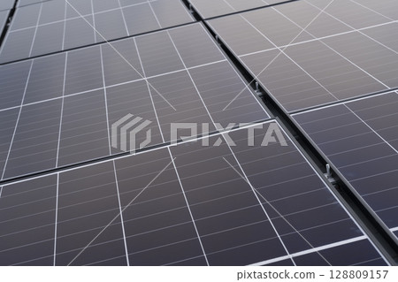 Installation of solar panels on the roof of a house Installation of solar panels on the roof of a house 128809157