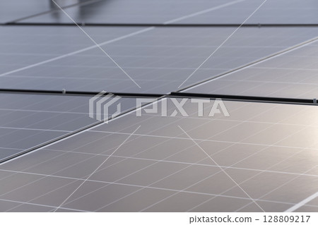 Installation of solar panels on the roof of a house 128809217