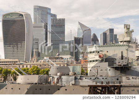 View of HMS Belfast (a historic warship) with the distinctive skyscrapers in the background. View of HMS Belfast (a historic warship) with the distinctive skyscrapers in the background. 128809294