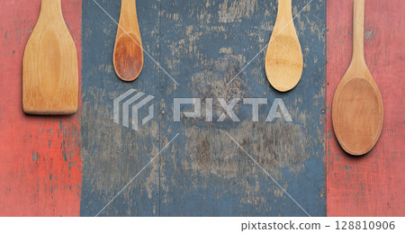 Set of Wooden Spoons and Spatulas on Rustic Distressed Wood Background. File with Clipping Path. Set of Wooden Spoons and Spatulas on Rustic Distressed Wood Background. File with Clipping Path. 128810906