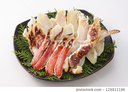 Plate of sliced raw king crab 128811186