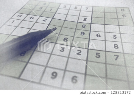 Pen on Partially Solved Sudoku Puzzle. Logic Game for Mental Focus and Brain-Boosting Entertainment Pen on Partially Solved Sudoku Puzzle. Logic Game for Mental Focus and Brain-Boosting Entertainment 128813172