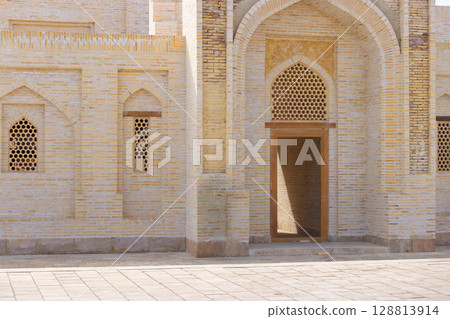 the brick wall background of islam culture in Bukhara, Uzbekistan 128813914