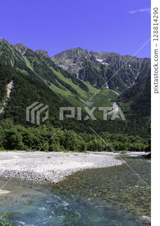 A spectacular view of the clear waters of the Azusa River and the Northern Alps in Kamikochi in summer A spectacular view of the clear waters of the Azusa River and the Northern Alps in Kamikochi in summer 128814290