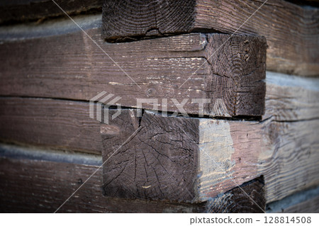 Corner Detail of Weathered Wooden Log Wall in Rustic Construction Corner Detail of Weathered Wooden Log Wall in Rustic Construction 128814508