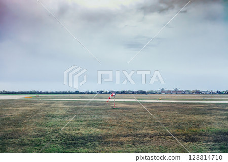 Windsock on airfield. Anemometer in Bratislava airport, Slovakia Windsock on airfield. Anemometer in Bratislava airport, Slovakia 128814710