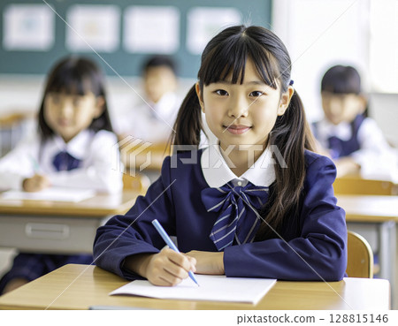 Japanese elementary school girls studying with calm expressions: Concentrated learning time in the classroom Japanese elementary school girls studying with calm expressions: Concentrated learning time in the classroom 128815146