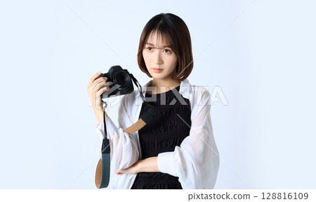 SLR camera and woman image 128816109