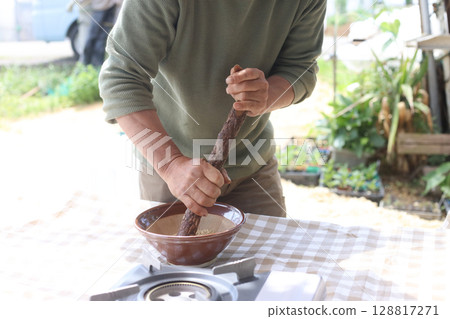 man eating sesame man eating sesame 128817271