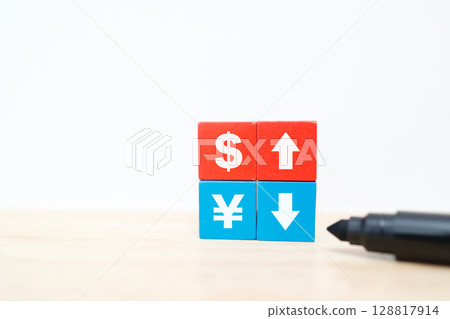 A composition of red and blue blocks and arrows indicating a strong dollar and a weak yen 128817914