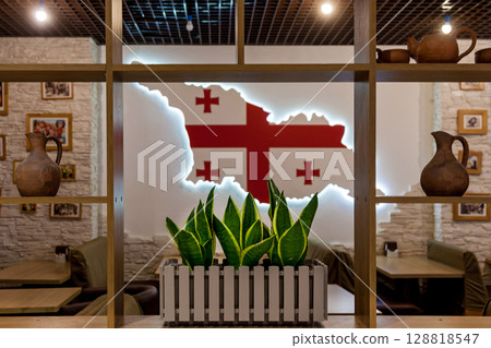Georgian restaurant interior with flag-shaped wall decor 128818547