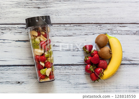 Fresh fruits and smoothie ingredients on rustic table Fresh fruits and smoothie ingredients on rustic table 128818550