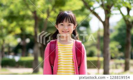 A cute girl smiling with a school bag in the park "Generative AI" A cute girl smiling with a school bag in the park "Generative AI" 128819554
