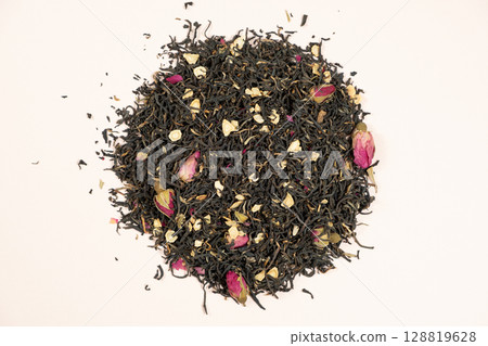 Loose Black Tea with Ginseng and Rose Petals Macro Top View 128819628