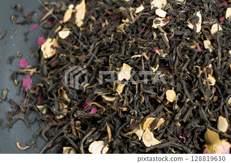 Loose Black Tea with Ginseng and Rose Petals Macro Top View Loose Black Tea with Ginseng and Rose Petals Macro Top View 128819630
