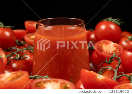 Refreshing Glass of Tomato Juice with Organic Tomatoes. 128819650