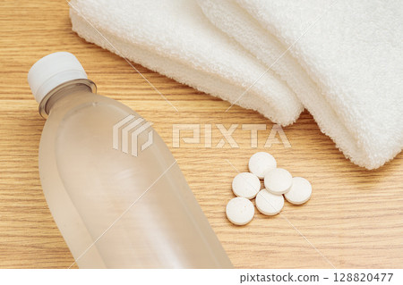 Heat stroke prevention | Water, salt tablets and towels 128820477