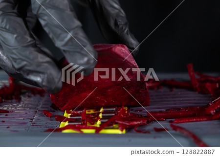 Person wearing protective black gloves grating fresh red beet root for healthy cooking preparation, emphasizing safety and vibrant ingredients Person wearing protective black gloves grating fresh red beet root for healthy cooking preparation, emphasizing safety and vibrant ingredients 128822887