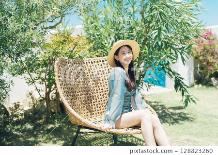 Young woman enjoying vacation at resort Young woman enjoying vacation at resort 128823260