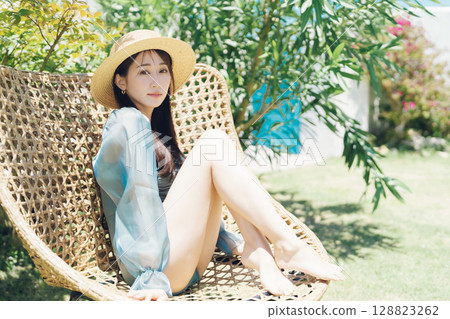 Young woman enjoying vacation at resort 128823262