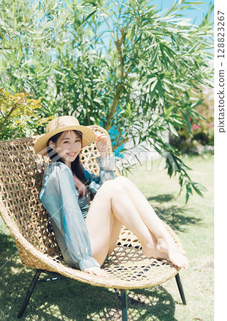 Young woman enjoying vacation at resort 128823267