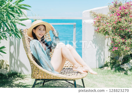 Young woman enjoying vacation at resort Young woman enjoying vacation at resort 128823270
