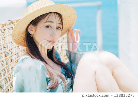 Young woman enjoying vacation at resort 128823273